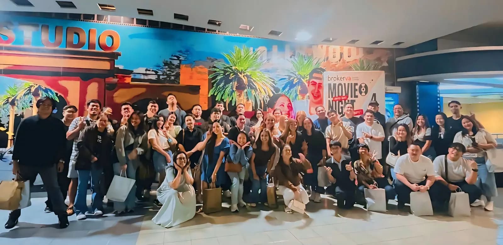 The full BrokerVA team gathered in the cinema lobby for the July 2026 quarterly gathering