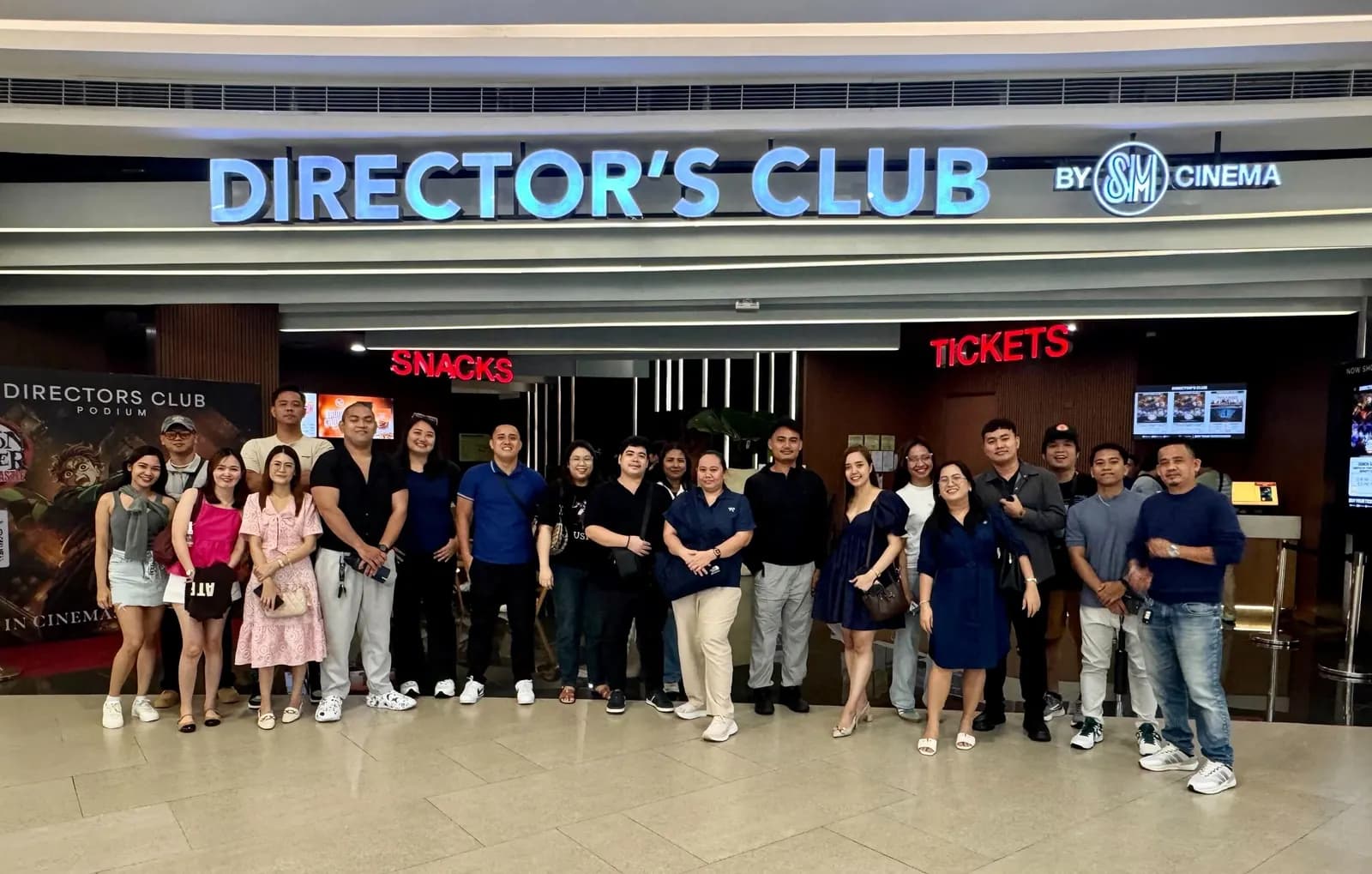 The team lined up outside the Director’s Club cinema entrance, September 2025 quarterly get-together