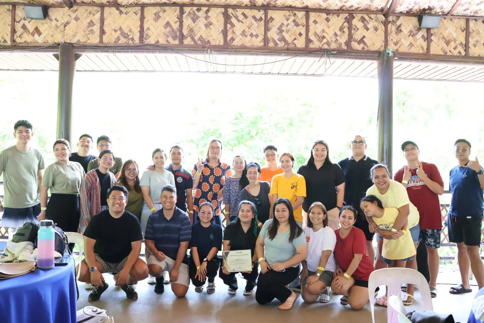 The BrokerVA team assembled under the open-air pavilion at the June 2025 team building retreat