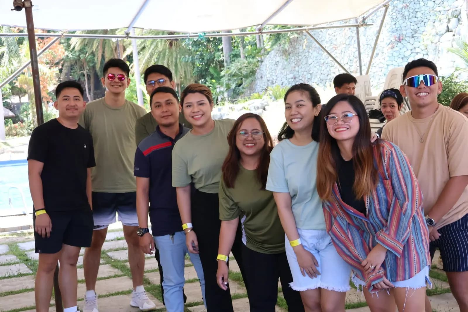 Teammates grouped along the garden walkway at the June 2025 team building retreat