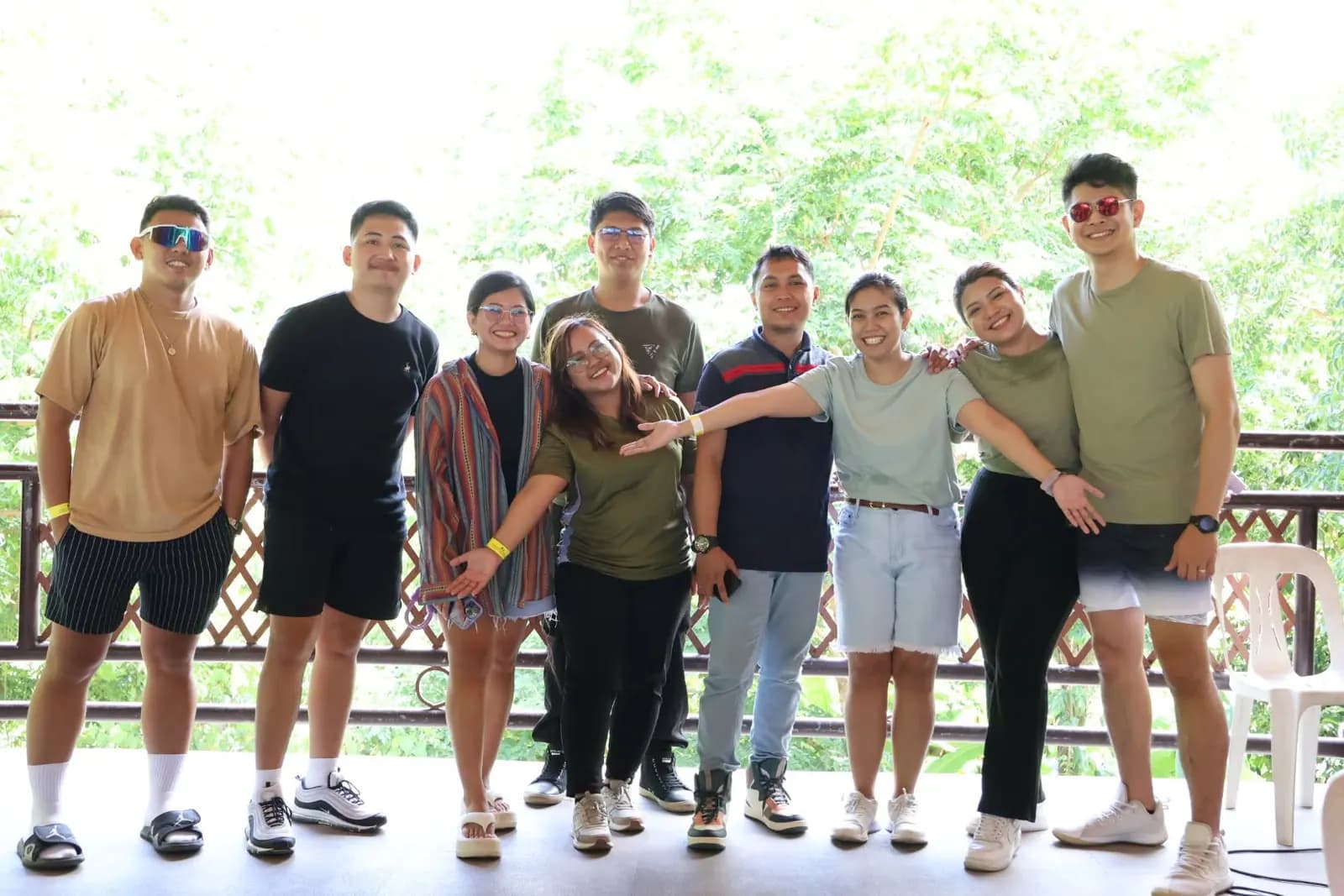 Teammates lined up arm in arm on the resort deck at the June 2025 team building retreat
